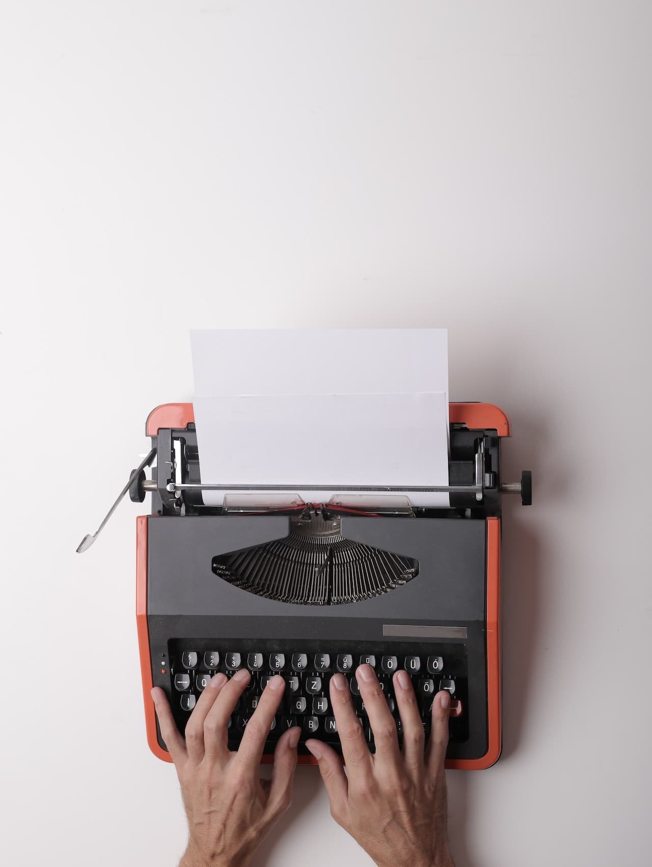A stack of business letters with different envelopes and stamps
