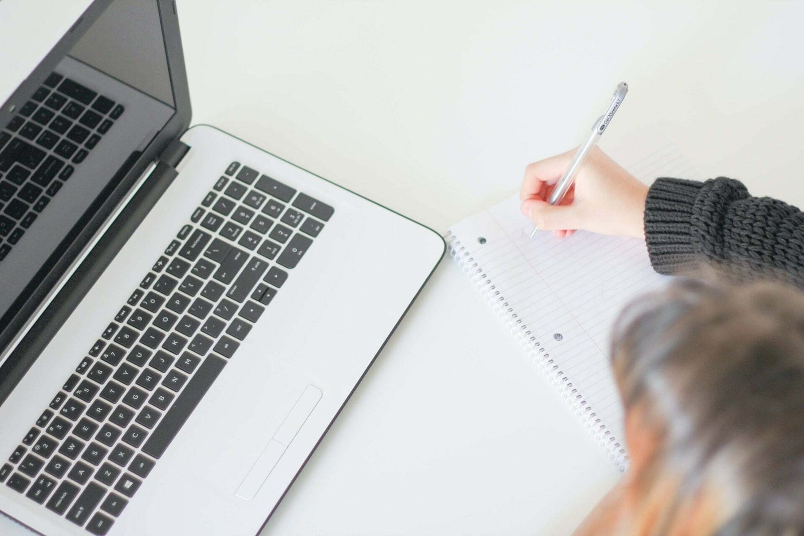 person with a laptop using grammarly